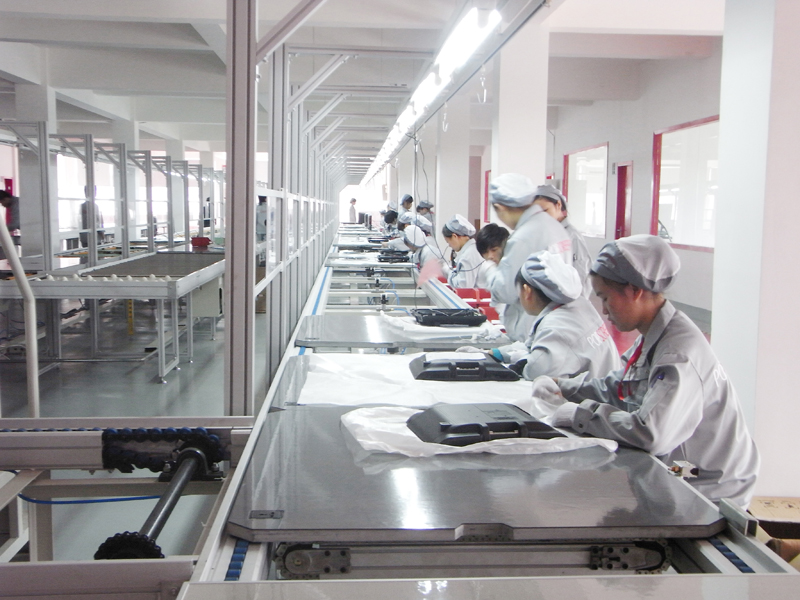 People are making digital screens tablets at the factory